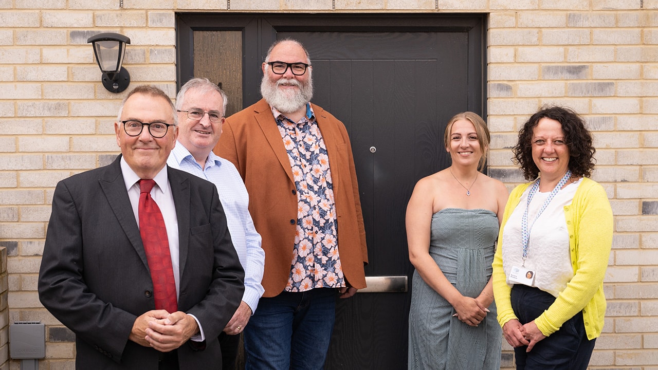 Clarion colleagues outside a new home in Barne Barton